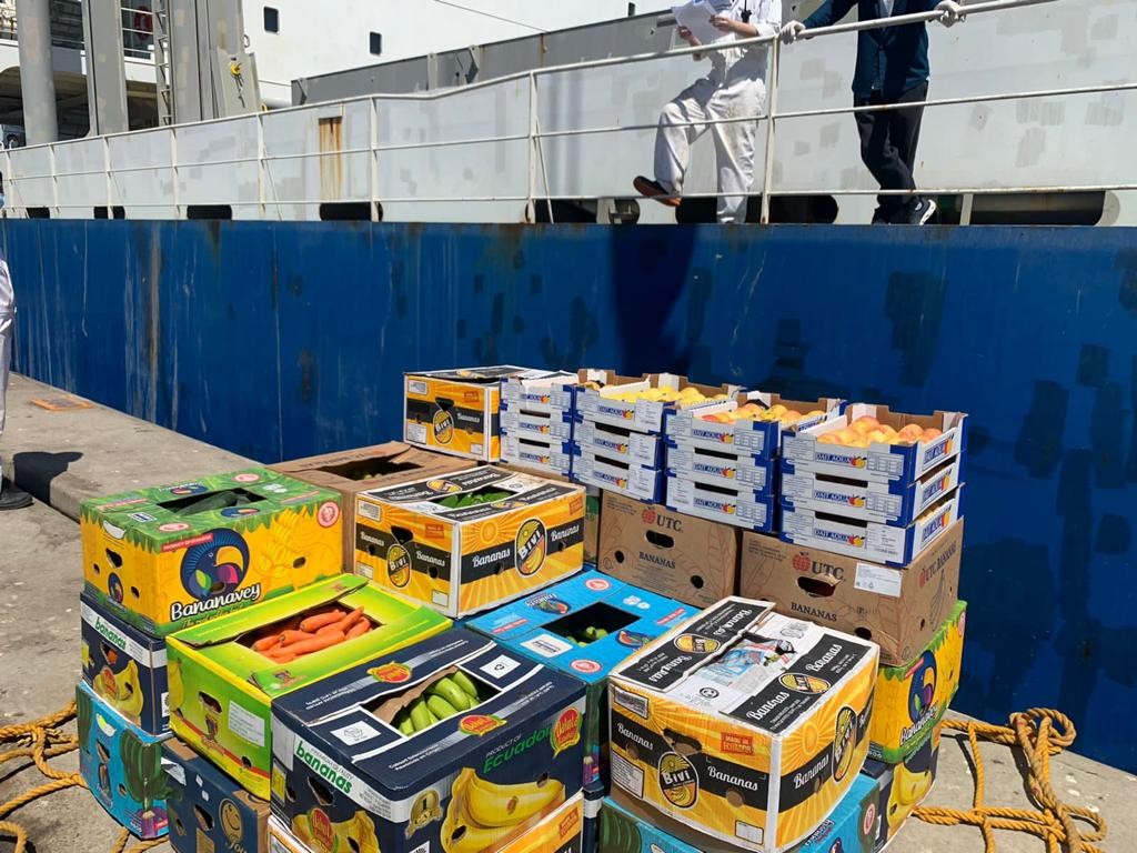 Fresh provisions prepared on a quayside beside a vessel